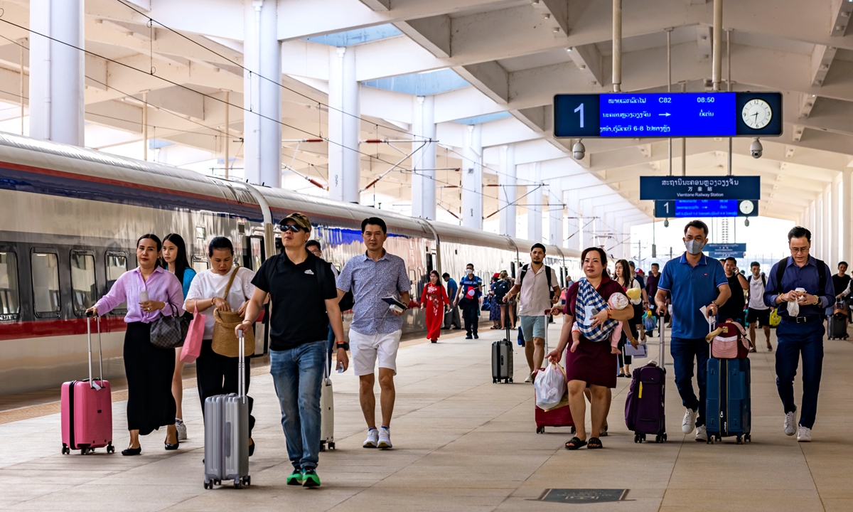 Passengers arrive at the Vientiane station in Laos via the cross-border passenger service of the China-Laos Railway. File photo: Courtesy of China State Railway Group