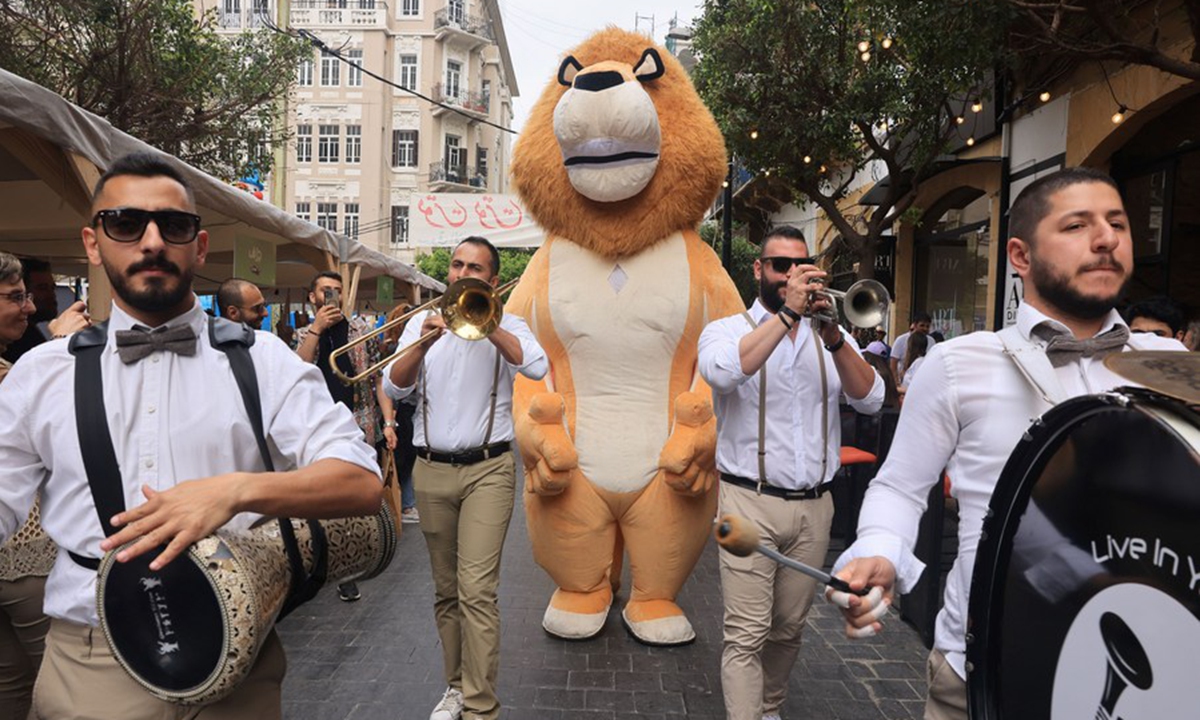 A band parades at a street fair in Beirut, Lebanon, on May 21, 2023. (Xinhua/Liu Zongya)






