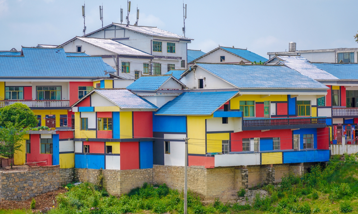 On May 23, 2022, Houses in a village in Guiyang, Southwest China's Guizhou Province, are decorated with red, yellow, blue and white squares.Photo: IC