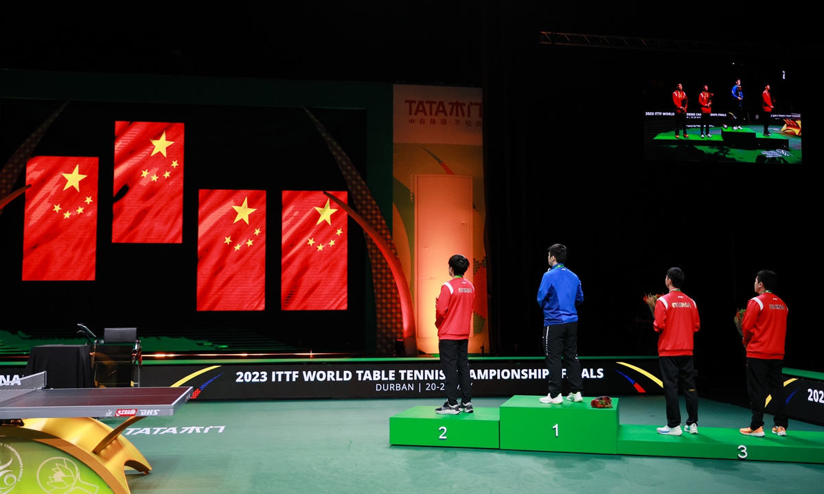 Chinese players react at the medal ceremony after the men's singles finals at the ITTF World Table Tennis Championships Finals in Durban, South Africa on May 28, 2023. Photo: VCG
