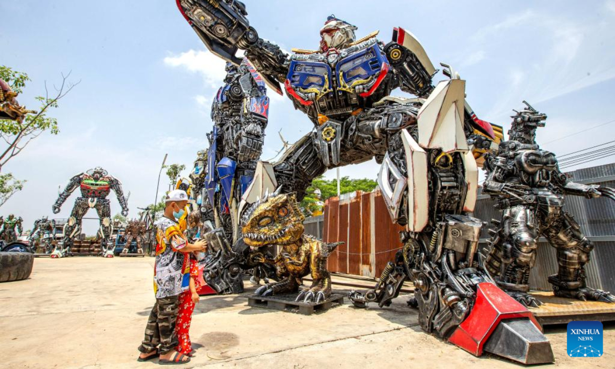 Tourists visit the Transformer Museum in Ang Thong, Thailand, May 25, 2023. The Transformer Museum displays robots and other artworks made from scrap metal, aming to convey the concept of environmental protection. Photo:Xinhua