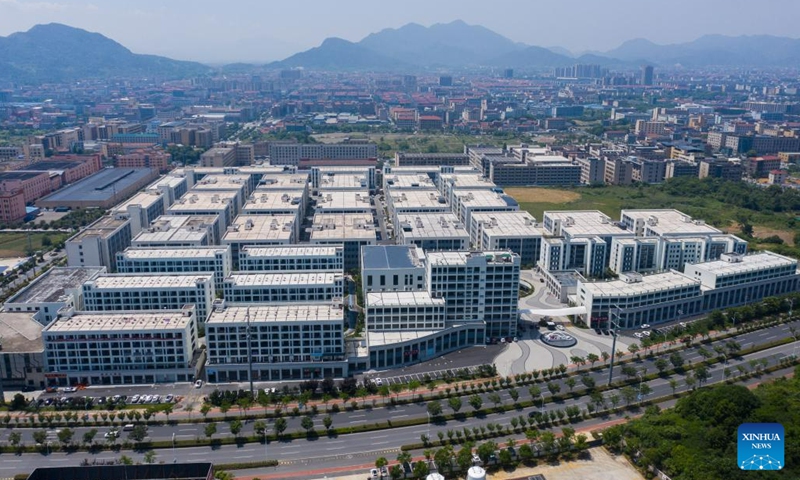 This aerial photo shows an international intelligent hosiery industrial park in Datang Subdistrict of Zhuji City, east China's Zhejiang Province, May 25, 2023. Datang Subdistrict of Zhuji City is the largest hosiery production base in the world, which produces 25 billion pairs of socks every year, accounting for more than 70% of the output of China and one third of the whole world.(Photo: Xinhua)