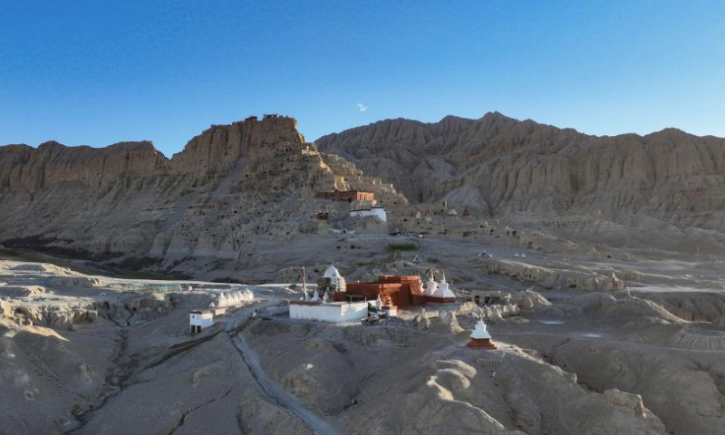 This aerial photo taken on May 26, 2023 shows the scenery of the ruins of the Guge Kingdom at dusk in Zanda County of Ngari Prefecture, southwest China's Tibet Autonomous Region. The ancient Guge Kingdom was probably founded in the 10th century but it was abandoned by the end of the 17th century. Only the mud-and-rock structures remained, sheltering their relics and wall paintings from the elements.

The Guge Kingdom Ruins are among the first group of historical relics placed under state protection in China. Remains of the kingdom's main castle now lie atop a riverside mountain, covering 180,000 square meters. (Xinhua/Jigme Dorje)