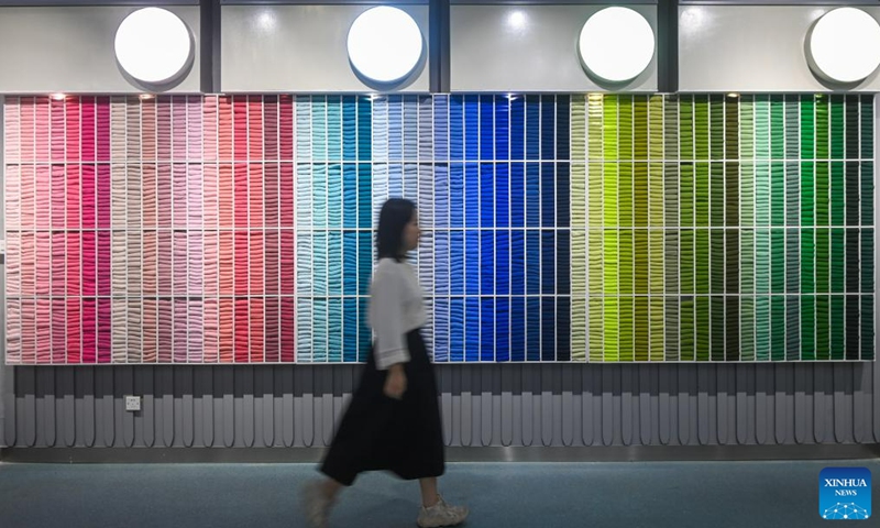 A women visits a hosiery museum in Datang Subdistrict of Zhuji City, east China's Zhejiang Province, May 25, 2023. Datang Subdistrict of Zhuji City is the largest hosiery production base in the world, which produces 25 billion pairs of socks every year, accounting for more than 70% of the output of China and one third of the whole world.(Photo: Xinhua)