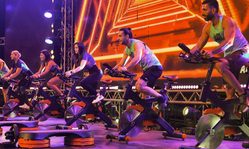 Participants demonstrate bike exercises during a Beirut Sports Festival held in Beirut, Lebanon, May 27, 2023. (Xinhua/Liu Zongya)