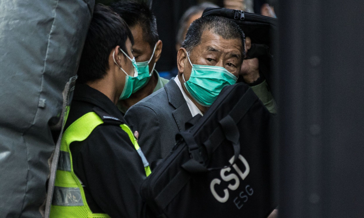 Media tycoon Jimmy Lai (R) is escorted into a Hong Kong Correctional Services van outside the Court of Final Appeal in Hong Kong on February 1, 2021, after being ordered to remain in jail while judges consider his fresh bail application. Photo: VCG