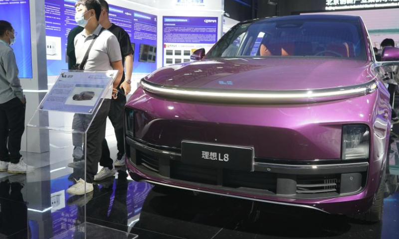 This photo taken on May 27, 2023 shows a new energy vehicle displayed at the exhibition area of Zhongguancun Forum in Beijing, capital of China. New energy vehicles and relevant products take the spotlight at this year's Zhongguancun Forum (ZGC Forum). (Xinhua/Ren Chao)