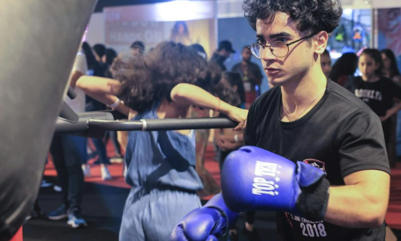 A participant tries boxing during a Beirut Sports Festival held in Beirut, Lebanon, May 27, 2023. (Xinhua/Liu Zongya)