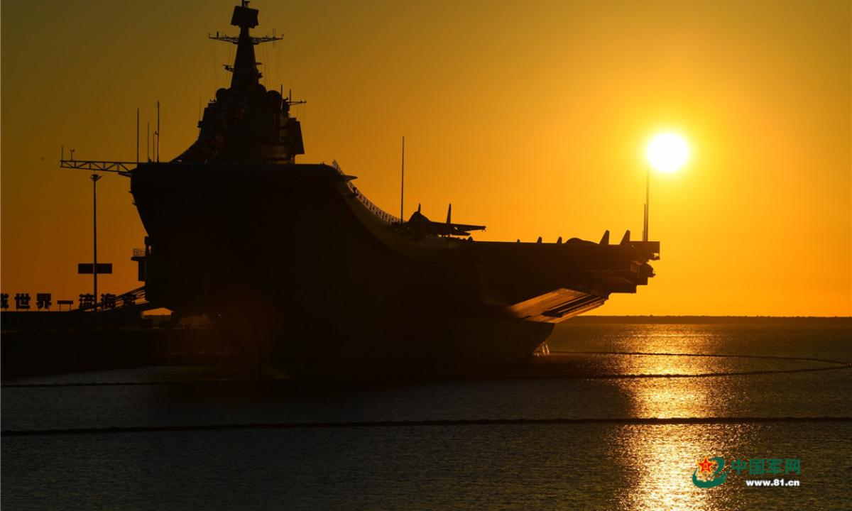 The picture shows aircraft carrier <em>Shandong</em> berths at a naval port in Sanya. China's first domestically-made aircraft carrier <em>Shandong</em> (Hull 17) was officially commissioned to the PLA Navy at a military port in Sanya, South China's Hainan Province, on the afternoon of December 17, 2019, making China one of the few countries in the world that have multiple carriers. Photo:China Military