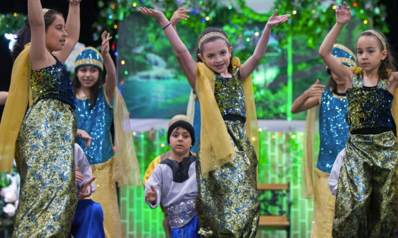 Children dance during the 2023 Carassauga Festival of Cultures in Mississauga, the Greater Toronto Area, Canada on May 27, 2023. (Photo by Zou Zheng/Xinhua)