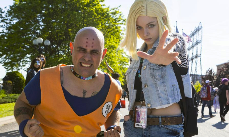 Cosplayers pose for photos during the 2023 Anime North in Toronto, Canada, on May 26, 2023. Showcasing all kinds of anime cultures, the annual three-day event is held here from Friday to Sunday to draw tens of thousands of fans from around the world. (Photo by Zou Zheng/Xinhua)