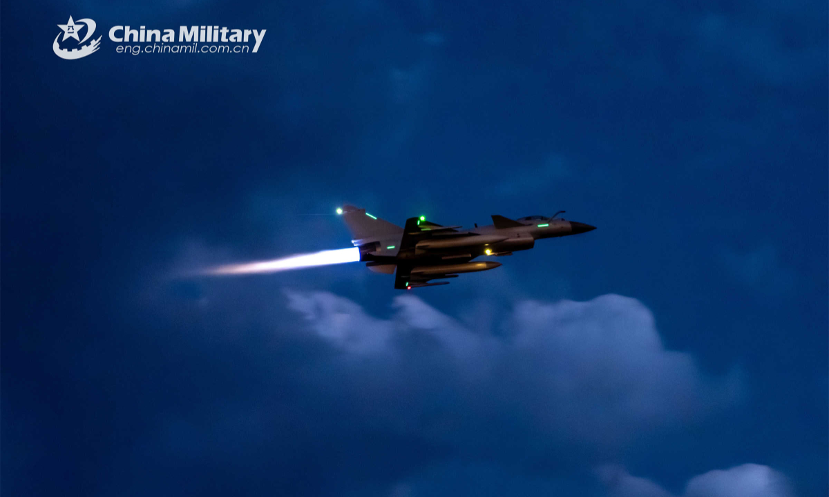 Fighter jet attached to a brigade of the air force under the PLA Southern Theater Command spears its way across the night sky during a round-the-clock flight training exercise in mid-May, 2023. Photo:China Military