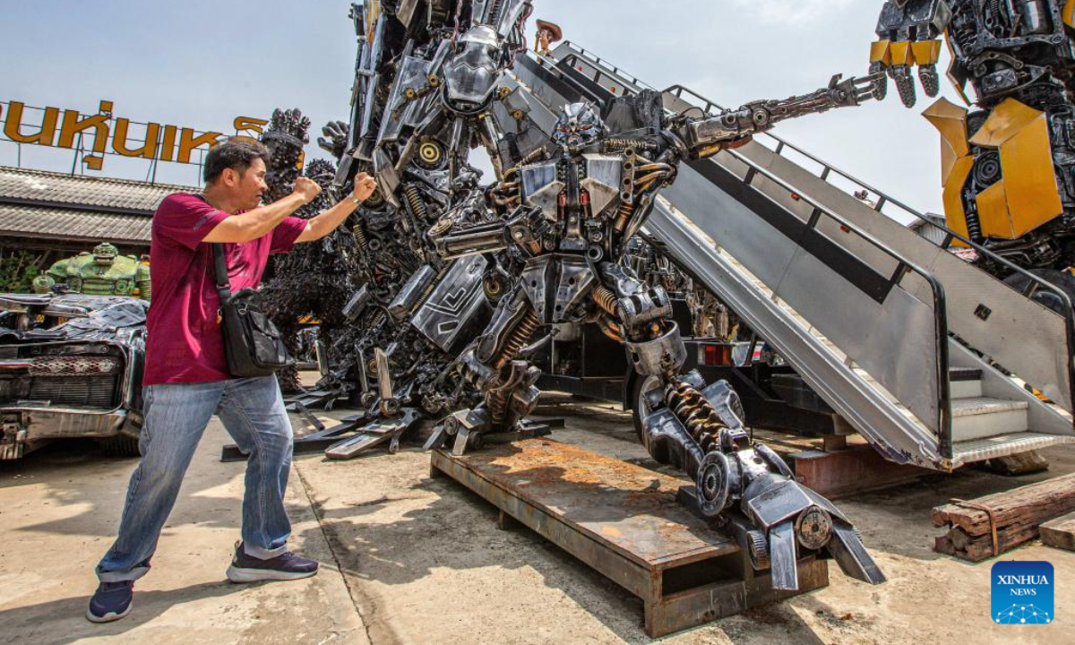 A tourist visits the Transformer Museum in Ang Thong, Thailand, May 25, 2023. The Transformer Museum displays robots and other artworks made from scrap metal, aming to convey the concept of environmental protection. Photo:Xinhua
