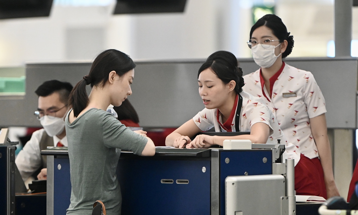 Cathay Pacific Airways staff are processing boarding procedures for passengers in Hong Kong on May 24, 2023. Photo: VCG