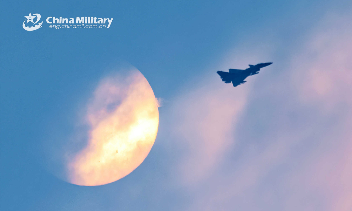 Fighter jet attached to a brigade of the air force under the PLA Southern Theater Command flies by the rising moon during a round-the-clock flight training exercise in mid-May, 2023. Photo:China Military
