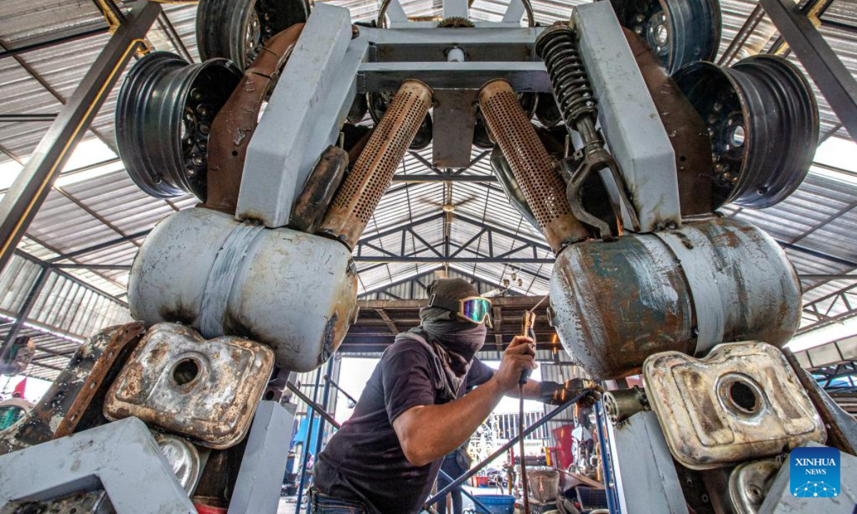 An artist works at the Transformer Museum in Ang Thong, Thailand, May 25, 2023. The Transformer Museum displays robots and other artworks made from scrap metal, aming to convey the concept of environmental protection. Photo:Xinhua