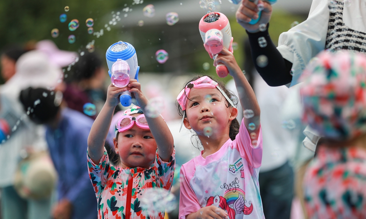 Kindergarten children play with water on May 31, 2023 in Congjiang, Southwest China's Guizhou Province, in an activity to celebrate International Children's Day on June 1. Photo: VCG