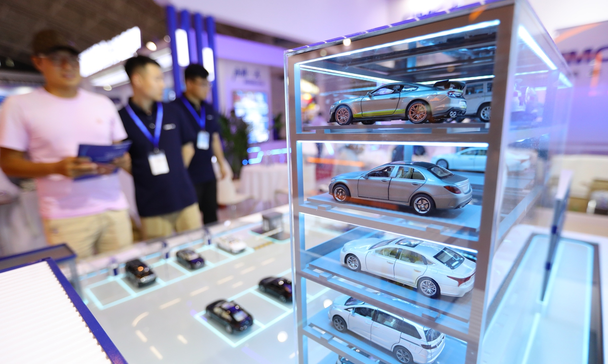 Visitors look at a parking case show at the China International Urban Parking Industry Expo in Beijing on May 30, 2023. The expo has thematic display areas like urban smart parking and charging facilities, in order to speed up the construction of smart cities. Photo: VCG
