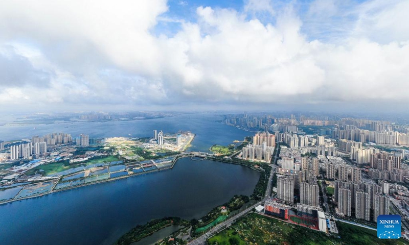 This aerial photo taken on May 25, 2023 shows the view of urban areas of Zhanjiang City in south China's Guangdong Province. Bordering the South China Sea on the east and the Beibu Gulf on the west and facing the Hainan Island to the south across the Qiongzhou Strait, Zhanjiang City in south China's Guangdong Province has the largest area of mangrove forest across the country and is an important base of aquatic products.(Photo: Xinhua)