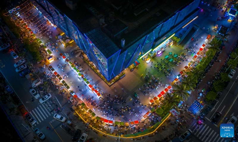 This aerial photo taken on May 25, 2023 shows a night market in Zhanjiang City, south China's Guangdong Province. Bordering the South China Sea on the east and the Beibu Gulf on the west and facing the Hainan Island to the south across the Qiongzhou Strait, Zhanjiang City in south China's Guangdong Province has the largest area of mangrove forest across the country and is an important base of aquatic products.(Photo: Xinhua)