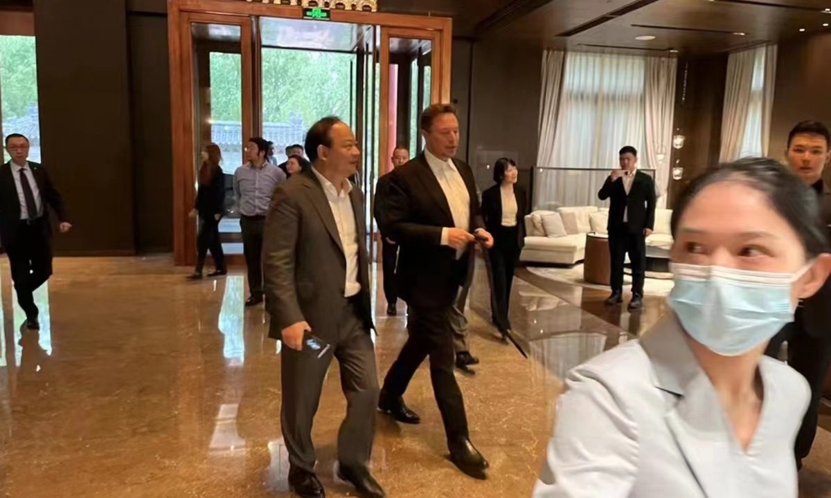 Tesla CEO Elon Musk and Zeng Yuqun, chairman of Chinese electric battery giant CATL, walk side by side in the lobby of a hotel. Photo: screenshot from social media platform