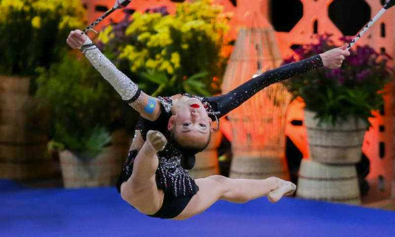 Aiym Meirzhanova of Kazakhstan competes during the clubs event of junior individual all-around final at the 14th Senior and 19th Junior Rhythmic Gymnastics Asian Championships in Manila, the Philippines, June 3, 2023. (Xinhua/Rouelle Umali)