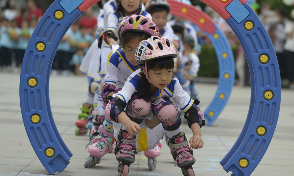 Children enjoy a fancy skating game at the China National Children's Center in Beijing to celebrate International Children's Day on May 31, 2023. Photo: Chen Tao/GT