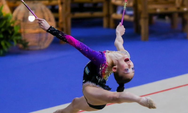 Lola Djuraeva of Uzbekistan competes during the clubs event of junior individual all-around final at the 14th Senior and 19th Junior Rhythmic Gymnastics Asian Championships in Manila, the Philippines, June 3, 2023. (Xinhua/Rouelle Umali)