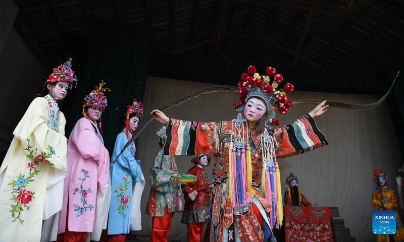 Students perform during a display of Anhui Opera at Fuling Village of Jixi County, Xuancheng City, east China's Anhui Province, May 30, 2023. In order to promote Anhui Opera and raise awareness of the traditional performing art, a primary school in Fuling Village has been offering a routine training program since 2003 for its students, hiring veteran folk artists as tutors.(Photo: Xinhua)