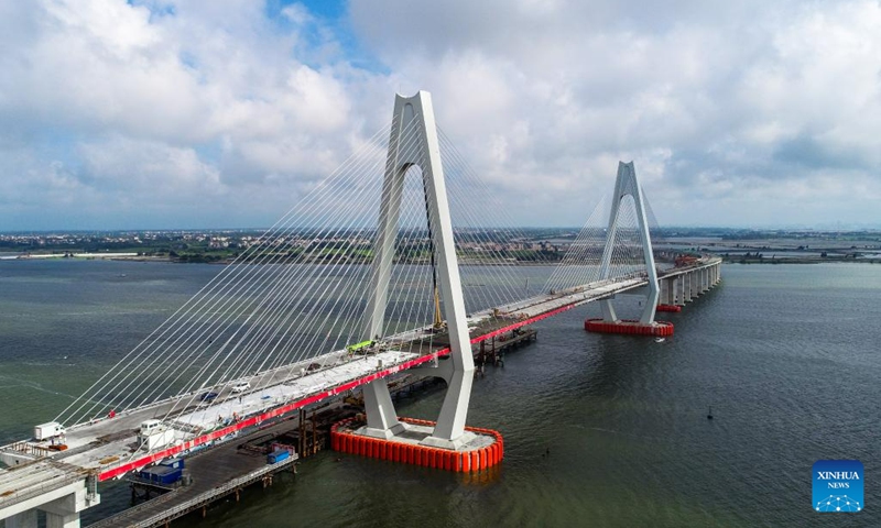 This aerial photo taken on May 25, 2023 shows the Luzhou grand bridge under construction in Zhanjiang City, south China's Guangdong Province. The cross-sea Luzhou grand bridge, with a total length of 562 meters and a main span of 300 meters, has entered the final stage of construction.(Photo: Xinhua)