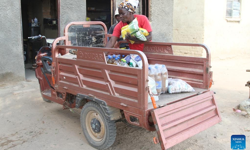 Adefi Mtambo delivers groceries to a rural store with her e-tricycle in Wedza, about 140 kilometres from Zimbabwe's capital Harare, May 19, 2023.(Photo: Xinhua)