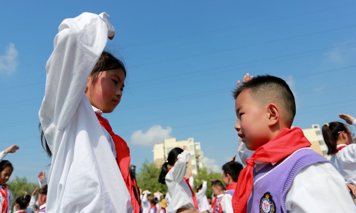 Students salute each other at a primary school in Lianyungang, East China's Jiangsu Province, on May 31, 2023. Photo: VCG
