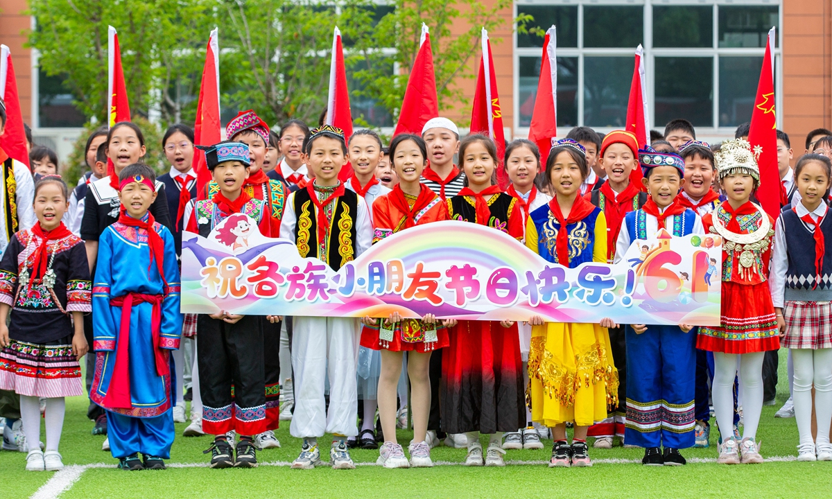 Students from all ethnic groups dressed in cultural costumes celebrate International Children's Day at a primary school in Haian, East China's Jiangsu Province, on May 31, 2023. Photo: VCG