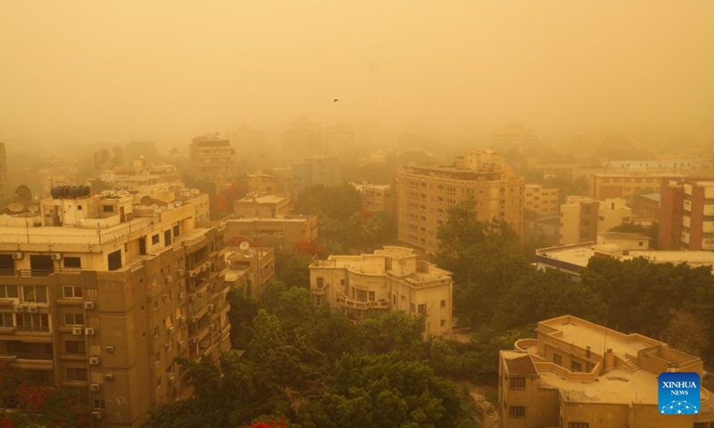 This photo taken on June 1, 2023 shows buildings shrouded in sand and dust during a sandstorm in Cairo, Egypt. A strong sandstorm hit the Egyptian capital city on Thursday afternoon.(Photo: Xinhua)