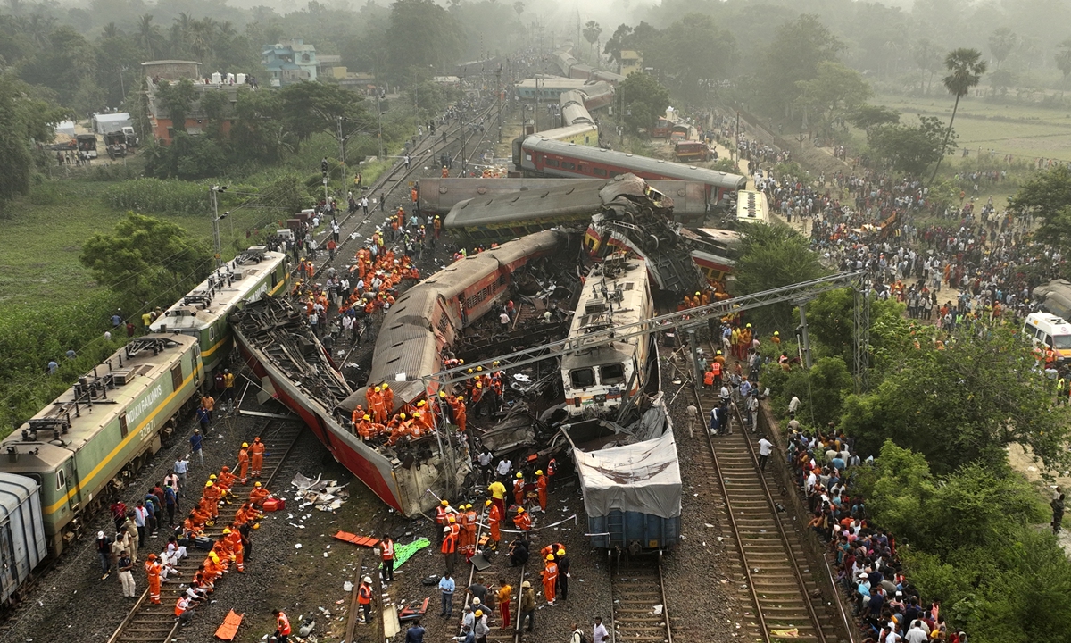 A drone shot of rescuers work at the site of passenger trains accident, in Balasore district, in the eastern Indian state of Orissa, Saturday, June 3, 2023. Hundreds of others were trapped inside more than a dozen mangled rail cars, in one of the country's deadliest train crashes in decades. Photo: VCG