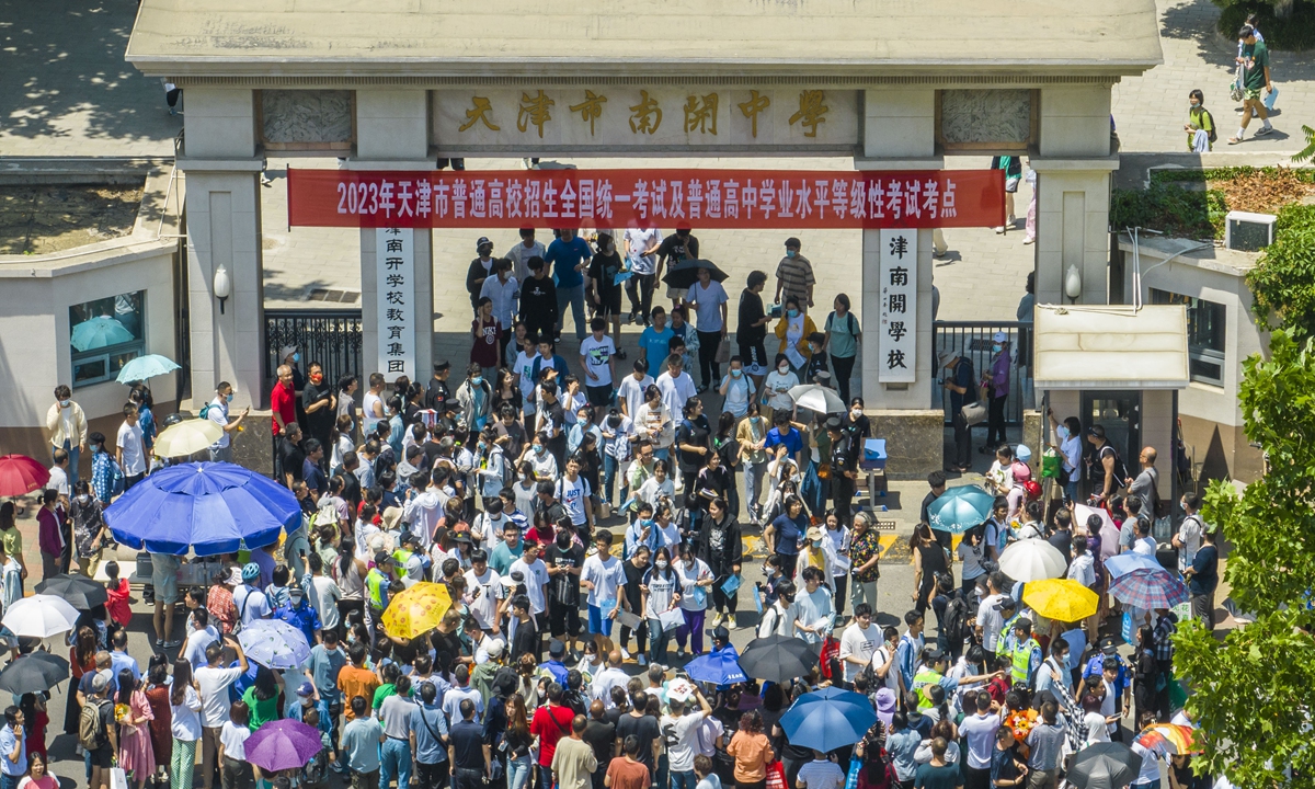 Students walk out of Nankai High School in North China's Tianjin on June 7, 2023 after the first day of the college entrance exams. A record number of 12.91 million people registered to sit for this year's exams. Photo: VCG