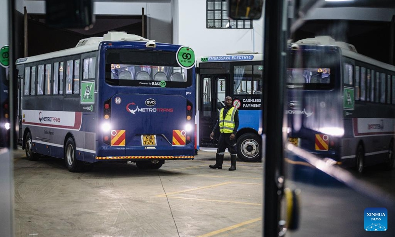 A staff member from BasiGo directs an electric bus into a charging station in Nairobi, Kenya, on June 2, 2023. The World Environment Day falls on June 5. In order to cope with climate change and protect the ecological environment, Kenya has made great efforts to promote the operation of electric buses and has introduced relevant policies to promote emission reduction.(Photo: Xinhua)