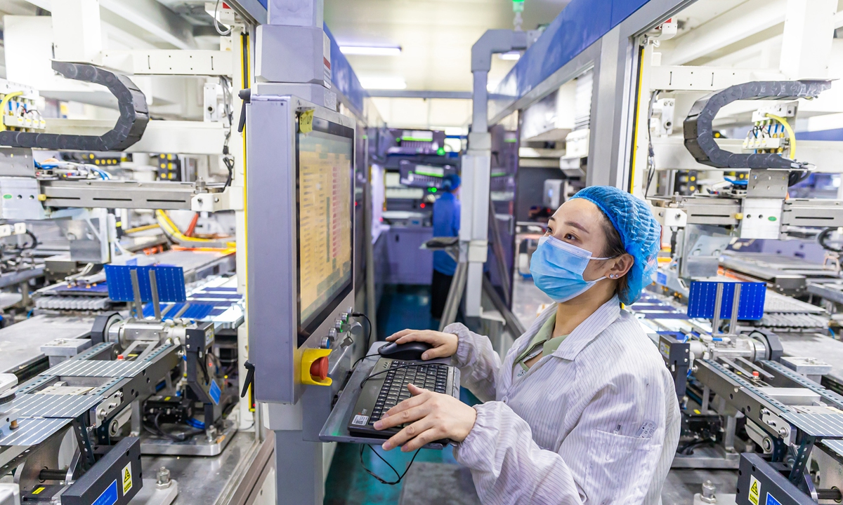 A photovoltaic
module
manufacturing line
at a new-energy
company in Haian,
East China's
Jiangsu Province
on June 6, 2023.
The photovoltaic
module will be
exported soon. The
city of Haian has
been building up
the photovoltaic
industrial chain
to expand market
opportunities
under China's
carbon neutrality
goal. Photo: