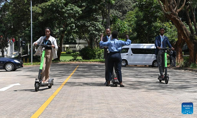 People ride electric scooters during a Low-carbon E-mobility Showcase activity in Nairobi, Kenya, on June 7, 2023. During the ongoing second session of the United Nations Habitat Assembly, a Low-carbon E-mobility Showcase activity was held at United Nations Office at Nairobi.(Photo: Xinhua)