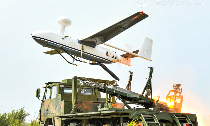 An unmanned aerial vehicle (UAV) attached to a brigade under the PLA 82nd Group Army is launched for a recent flight training exercise. (eng.chinamil.com.cn/Photo by Liu Kui)