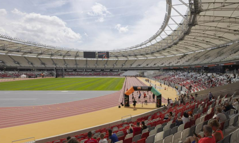 People participate in a family day event in the newly opened National Athletics Centre in Budapest, Hungary on June 17, 2023. The brand new National Athletics Centre will host 2023 World Athletics Championships during August 19-27. (Photo by Attila Volgyi/Xinhua)