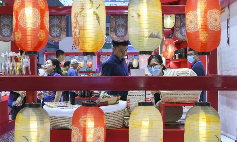 Visitors choose products at China's Shaanxi booth during the 19th China (Shenzhen) International Cultural Industries Fair in Shenzhen, south China's Guangdong Province, June 9, 2023. The 19th China (Shenzhen) International Cultural Industries Fair kicked off here on Wednesday, which is expected to inject new impetus into the development of the country's cultural industry. Over 300 exhibitors from more than 50 countries and regions have registered to display their distinctive products in the fair's Belt and Road International Exhibition Area. (Xinhua/Liang Xu)


