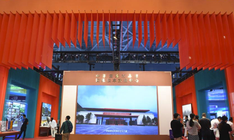 People visit the exhibition area of the China National Archives of Publications and Culture at the 19th China (Shenzhen) International Cultural Industries Fair in Shenzhen, south China's Guangdong Province, June 8, 2023. The five-day national-level fair closed Sunday in Shenzhen. (Xinhua/Liang Xu)