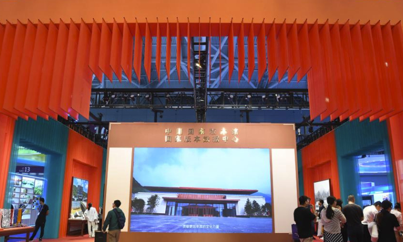 People visit the exhibition area of the China National Archives of Publications and Culture at the 19th China (Shenzhen) International Cultural Industries Fair in Shenzhen, south China's Guangdong Province, June 8, 2023. The five-day national-level fair closed Sunday in Shenzhen. (Xinhua/Liang Xu)