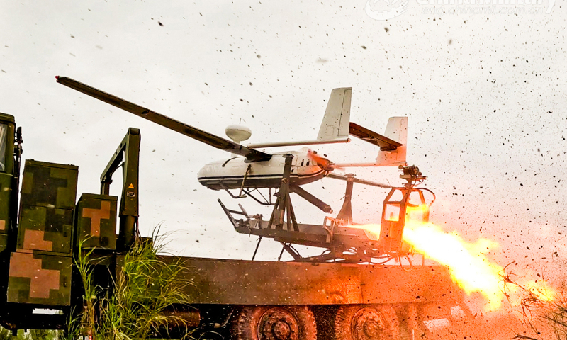 An unmanned aerial vehicle (UAV) attached to a brigade under the PLA 82nd Group Army is launched for a recent flight training exercise. (eng.chinamil.com.cn/Photo by Liu Kui)