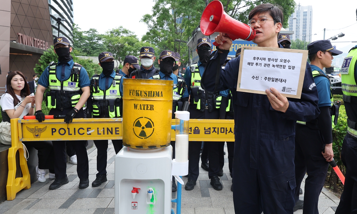 People rally in front of the Japanese Embassy in South Korea to protest against Japan's plan to dump nuclear-contaminated wastewater into the sea from the Fukushima nuclear facility, in Seoul on June 7, 2023. The protesters used a water cooler to demonstrate the alleged damage the dumping plan would do to the oceans. The Fukushima Daiichi nuclear power plant has reportedly sent seawater into an underwater tunnel designed to dump nuclear-contaminated wastewater into the ocean since June 5. Photo: VCG