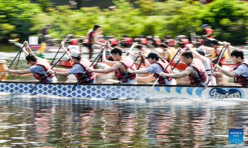 Participants compete at Boston Hong Kong Dragon Boat Festival in Cambridge, Massachusetts, the United States, on June 11, 2023. More than 60 teams took part in this event on Sunday.(Photo: Xinhua)