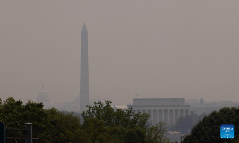 The U.S. Capitol building, the Washington Monument and the Lincoln Memorial are shrouded in haze, as smoke from wildfires in Canada brings unhealthy air quality to the East Coast, in Washington, D.C., the United States, on June 7, 2023.(Photo: Xinhua)