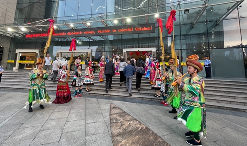 Diplomats from countries including Yemen, Cyprus, Greece, and Malta are welcomed by Miao and other ethnic minorities at the Guiyang Theatre. Photo: Liu Caiyu/GT