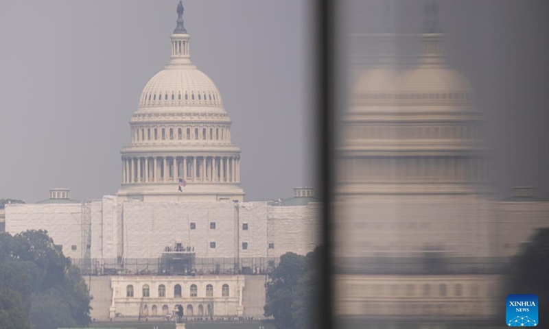 The U.S. Capitol building is shrouded in haze, as smoke from wildfires in Canada brings unhealthy air quality to the East Coast, in Washington, D.C., the United States, on June 7, 2023.(Photo: Xinhua)